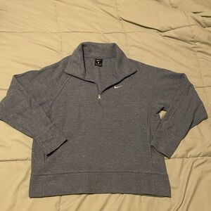 Nike womens quarter zip sweatshirt with front pockets. Light blue/purple color.